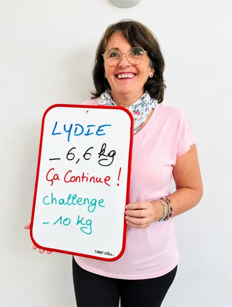 Une membre du club Vitality Nutriclub avec son ardoise de bilan